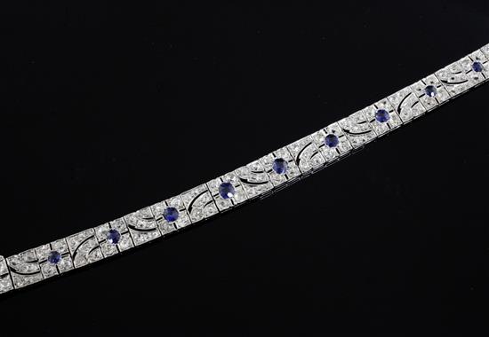 An attractive 1920s pierced white gold, sapphire and diamond bracelet, 18cm.